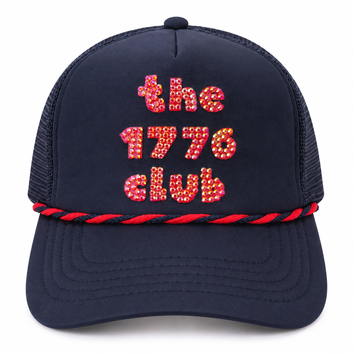Woman wearing navy rhinestone the 1776 club trucker hat by the water