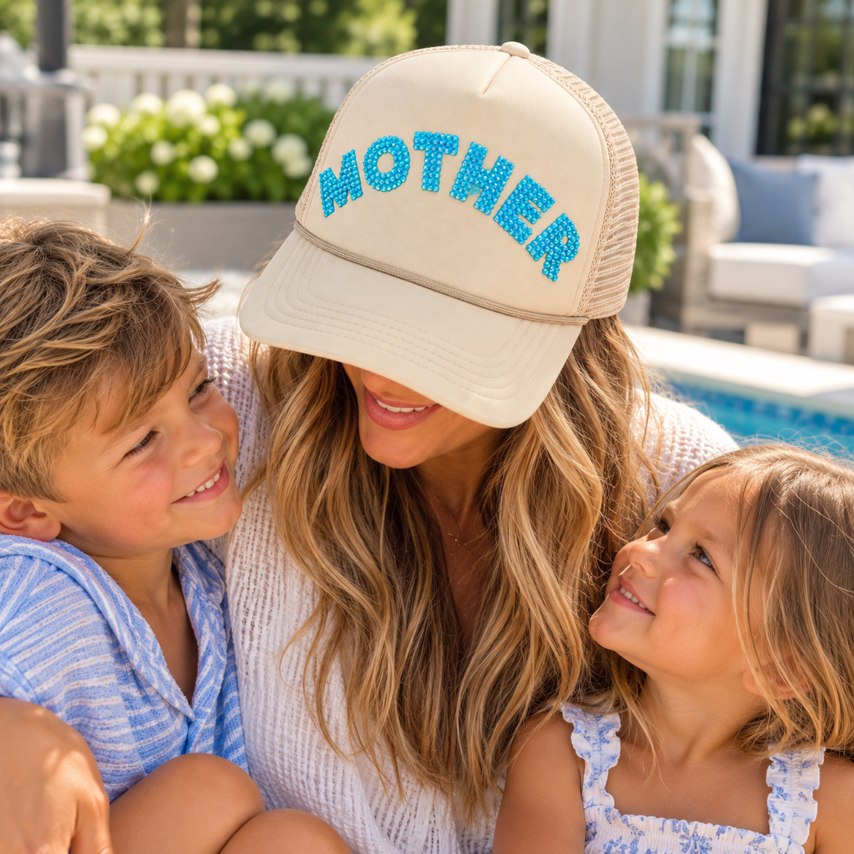 Cream trucker hat with turquoise rhinestone MOTHER lettering