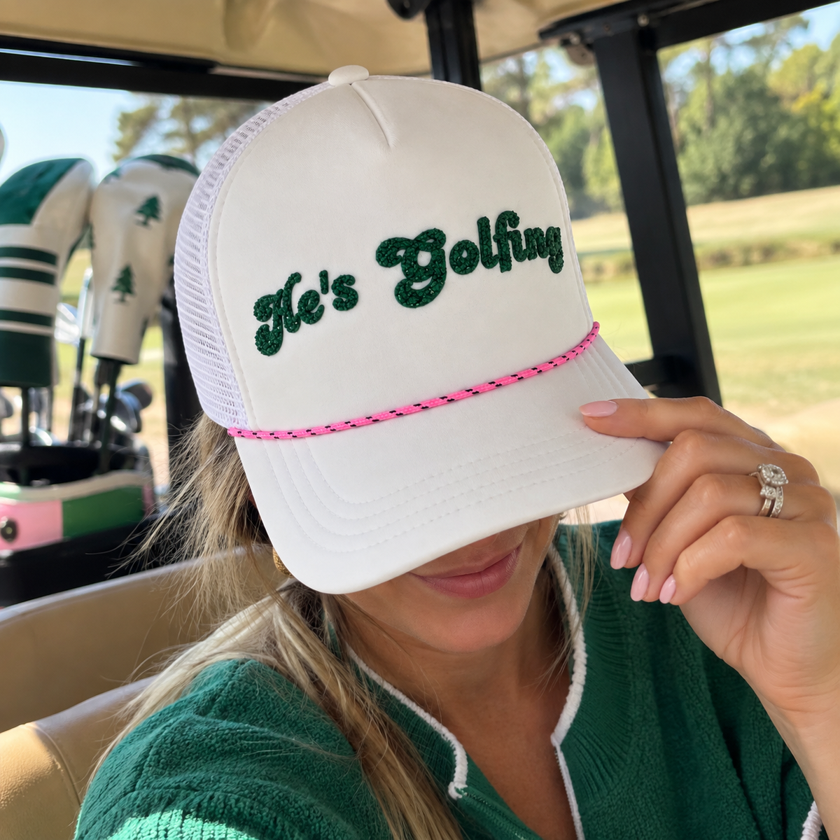 He's Golfing Trucker Hat